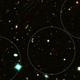 Illustration for article titled This ancient galaxy cluster is hiding in plain sight